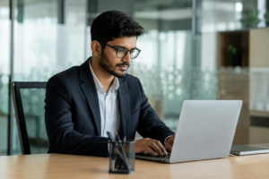 Business analyst course in Coimbatore student analyzing business data and dashboards in a modern corporate office at Venster School of Excellence